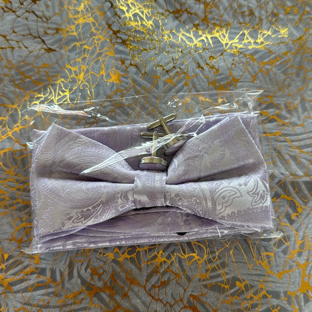 Bow tie, hankie, cuff links, flower boutonnière.